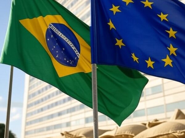 Bandeiras do Brasil e UE em frente ao Ministério da Agricultura em Brasília, simbolizando acordo Mercosul-UE e reuniões na Europa.