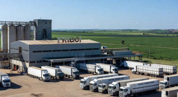 Frigorífico brasileiro com caminhões de exportação de carne para os EUA em paisagem rural.