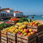 Caixas de hortifrutis frescos empilhadas em porto brasileiro para exportação direta a São Tomé e Príncipe.
