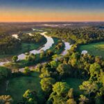 Paisagem da Floresta Amazônica com áreas de pastagem, representando impactos do Prodes para produtores rurais.